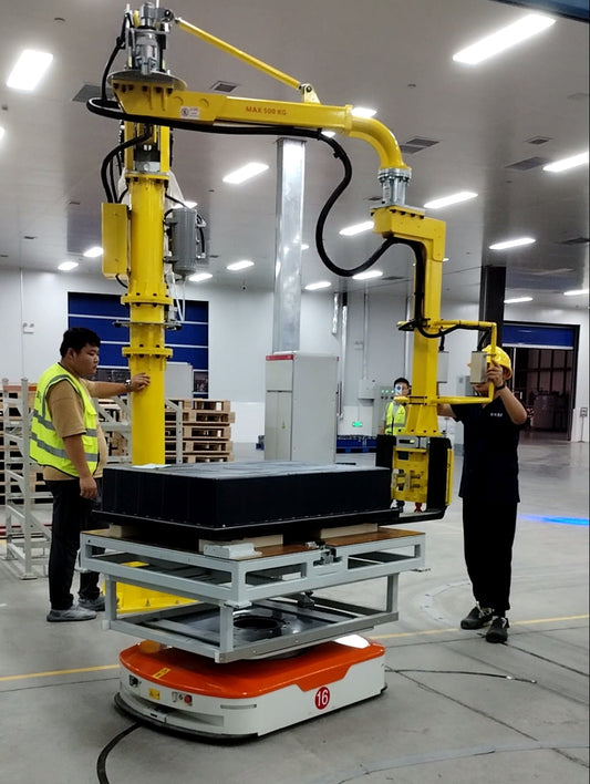 HB Torque heavy-duty rigid-arm manipulator lifting a large liquid-cooled battery pack for electric trucks.