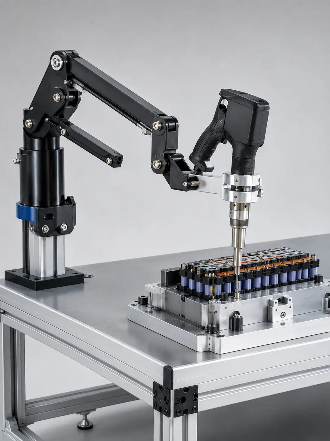 Machined clamp and rigid torque reaction arm for ESTIC PULSE HS pistol nutrunner workstation