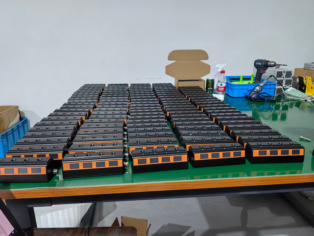 Four-position screwdriver bit selectors arranged on a workshop assembly table