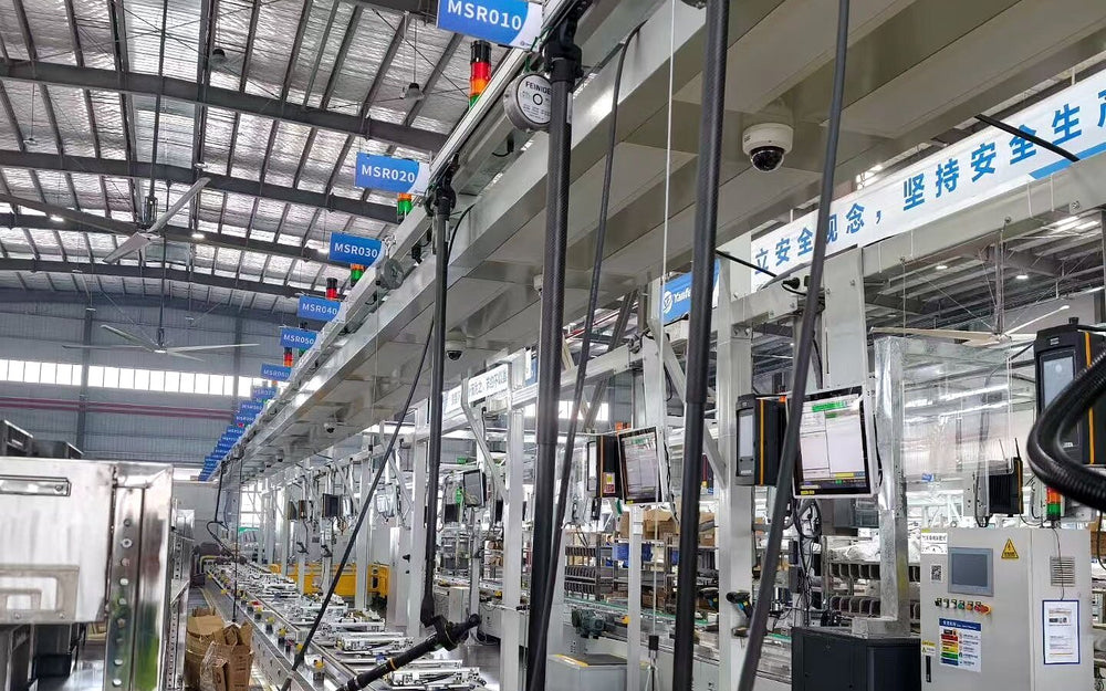 Client production line with suspended torque reaction arms